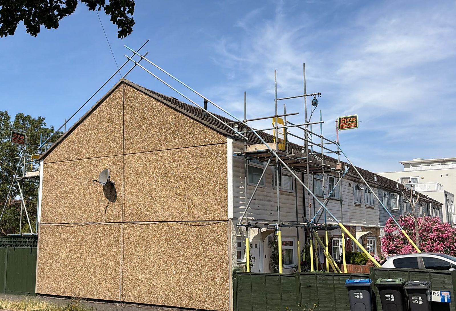 FJS scaffolding erected across a row of houses in London